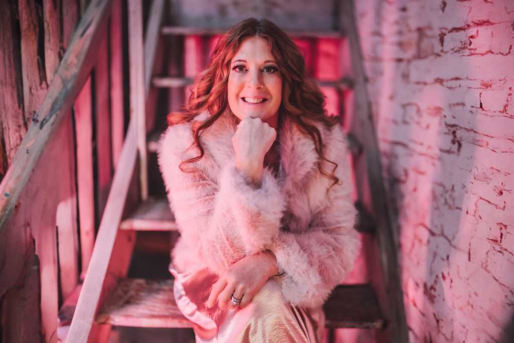 A woman sitting on a staircase.