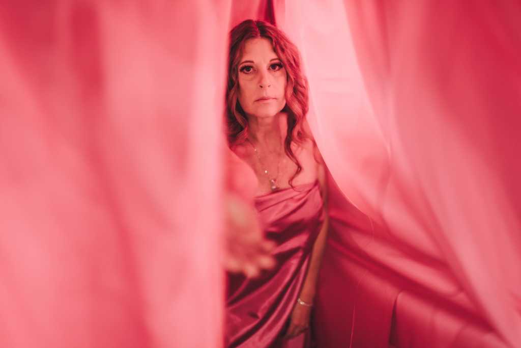 A woman in a pink dress.